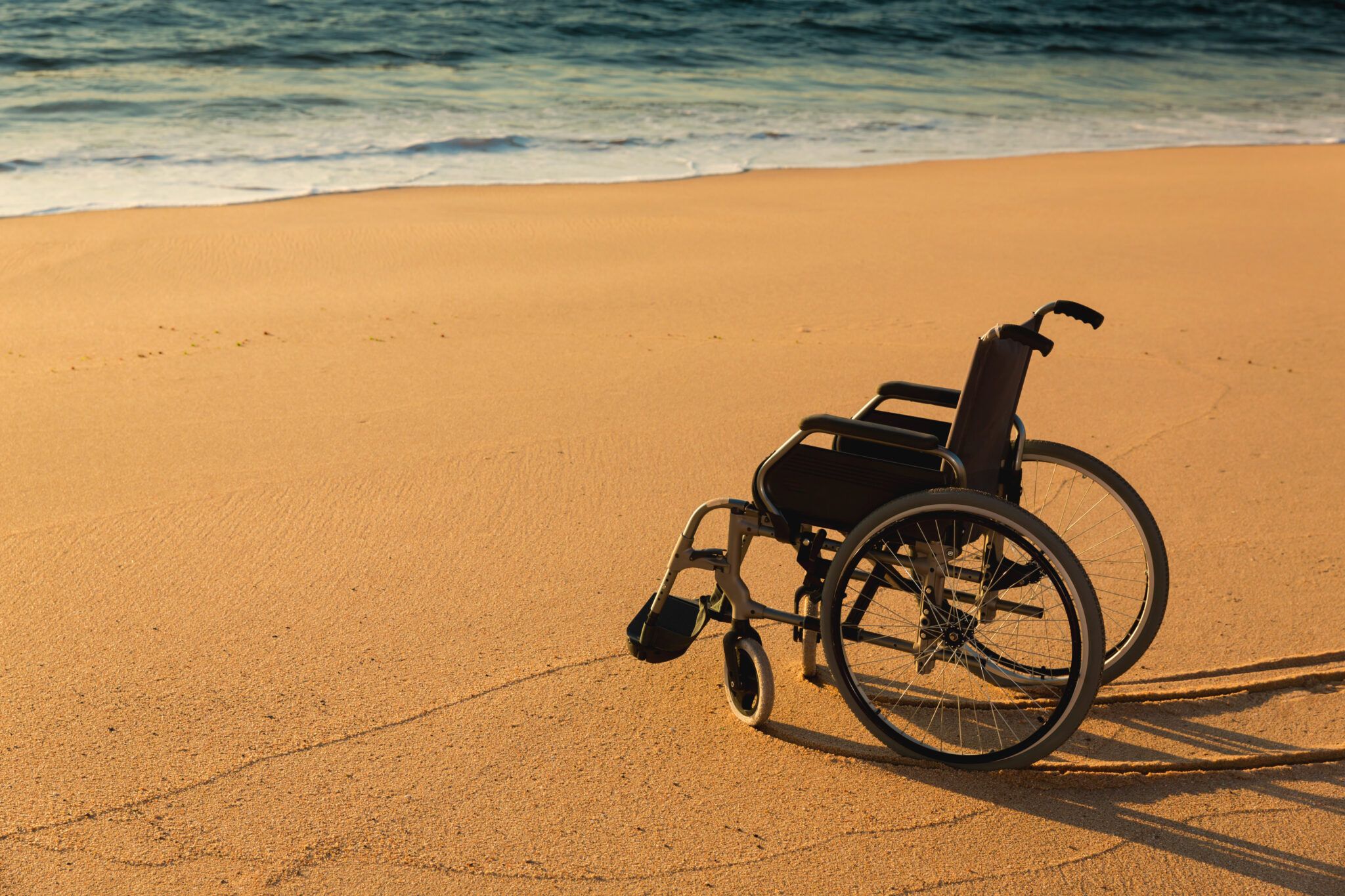 Wheelchair on the beach Reliant Destinations by Addison
